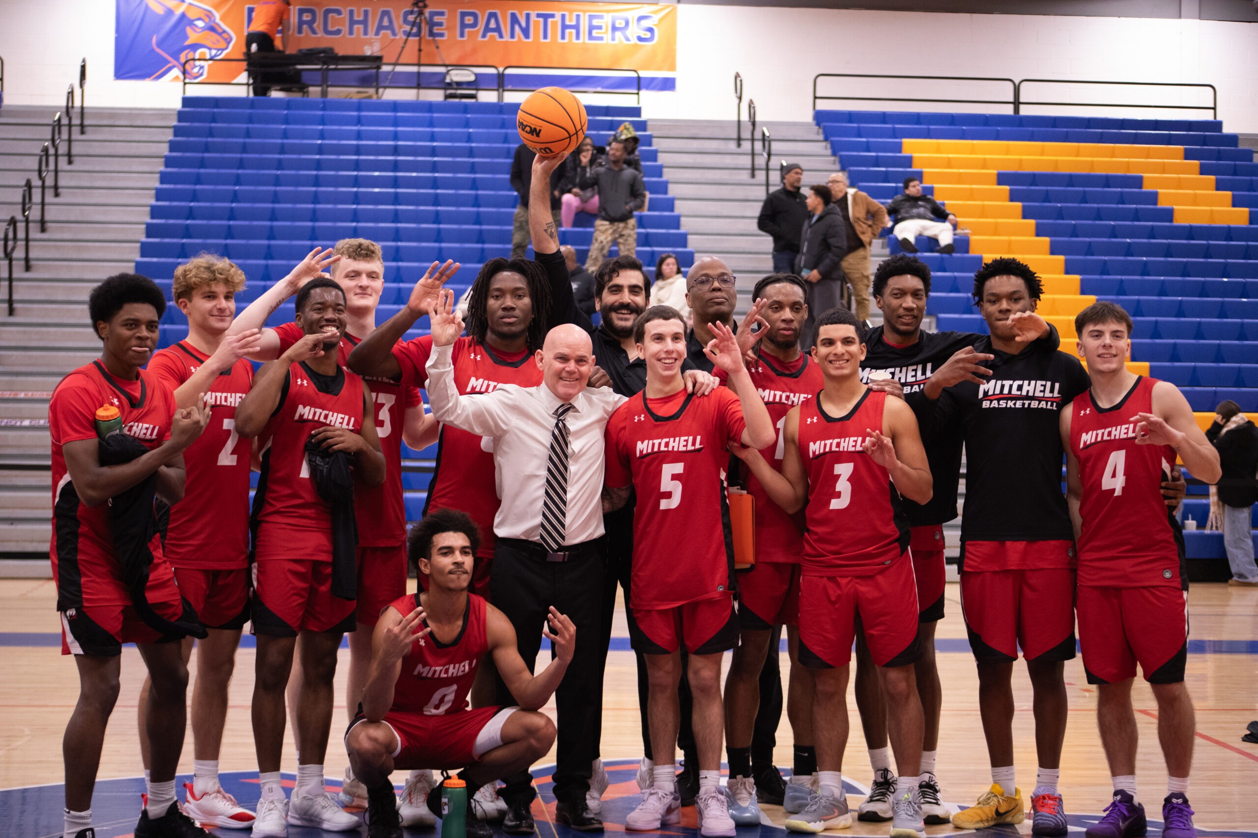 Coach Todd Peretz and men's basketball team